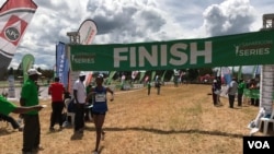 An athlete finishes the Ndalat cross country championship race. Some athletes have come to compete after years of training on their own. (M. Yusuf/VOA)