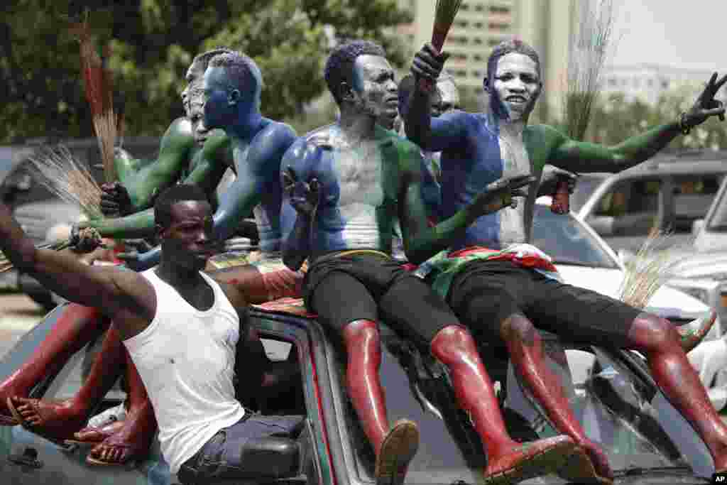 Supporters of new Nigerian President, Muhammadu Buhari, celebrate after his inauguration in Abuja. Nigerians celebrated their newly reinforced democracy, dancing and singing songs and praises of Buhari, the first candidate to beat a sitting president at the polls.