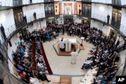 Pope Francis leads a Mass during his visit to the Regina Coeli detention center in Rome, March 29, 2018.