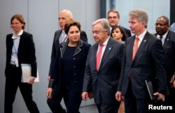 Patricia Espinosa, Executive Secretary of the United Nations Framework Convention on Climate Change, and U.N. Secretary-General Antonio Guterres arrive for the opening of the High-Level Segment of COP23 U.N. Climate Change Conference in Bonn, Germany, Nov