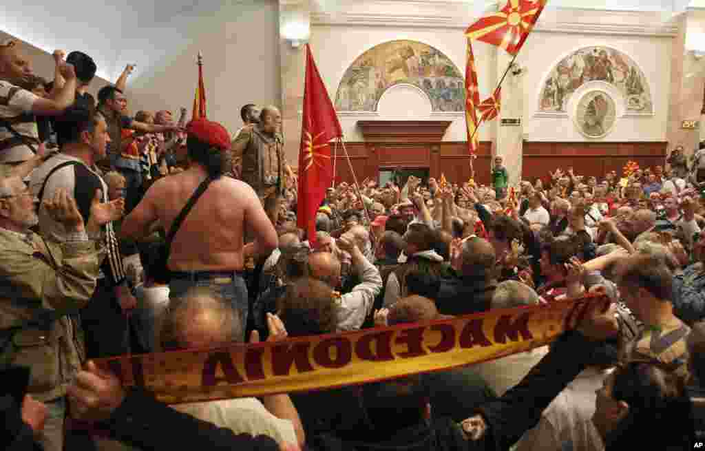 Protesters enter into the parliament building in Skopje, Macedonia, April 27, 2017. 