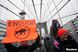 Demonstrators participate in an anti-gun violence rally sponsored by One Million Moms for Gun Control in New York, Jan. 21, 2013.