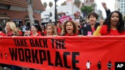 FILE - Participants march against sexual assault and harassment at the #MeToo March in the Hollywood section of Los Angeles, Nov. 12, 2017. 