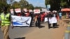 FILE - Protesters march against attacks on people with albinism in Lilongwe, the capital of Malawi, in early 2016.