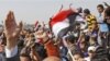 Iraqi Protesters Block Bridge in South