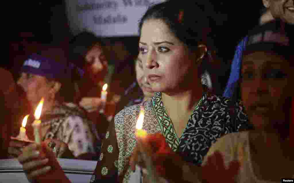 Women hold lighted candles during a rally condemning the attack on schoolgirl Malala Yousafzai, in Karachi, Pakistan, October 11, 2012.