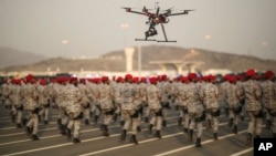 FILE - A military parade by Saudi security forces in preparation for the annual Hajj pilgrimage in Mecca, Saudi Arabia.