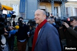French politician Alain Juppe leaves a polling station in Bordeaux, Nov, 27, 2016.