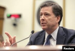 FILE - FBI Director James Comey has warned that spreading encryption on smartphones was "harmful" to law enforcement.