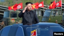 FILE - North Korea's leader Kim Jong Un inspects artillery launchers ahead of a military drill marking the 85th anniversary of the establishment of the Korean People's Army, April 25, 2017. 