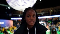 FILE - Climate activist Vanessa Nakate poses for a photo during the COP26 UN Climate Summit in Glasgow, Scotland, Nov. 8, 2021.