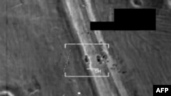Image-grab shows F/A-18 Hornet fighter jet strike on what US army officals call an Islamic State target at undisclosed location in northern Iraq, August 8, 2014.