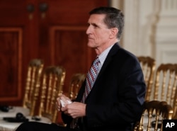 FILE - National Security Adviser Michael Flynn sits before the start of the news conference of President Donald Trump and Japanese Prime Minister Shinzo Abe in the East Room of the White House, Feb. 10, 2017. The House intelligence committee is issuing su