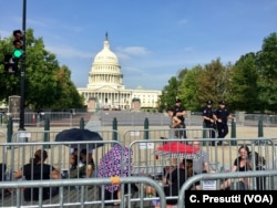 Crowds start queueing early to walk by the casket of Senator John McCain as he lies in state in the Capitol Rotunda, Aug. 31, 2018, in Washington.