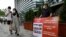 A protester stands to oppose South Korean President Moon Jae-in's possible visit to Japan in front of a building which houses Japanese embassy in Seoul, South Korea, July 19, 2021. 