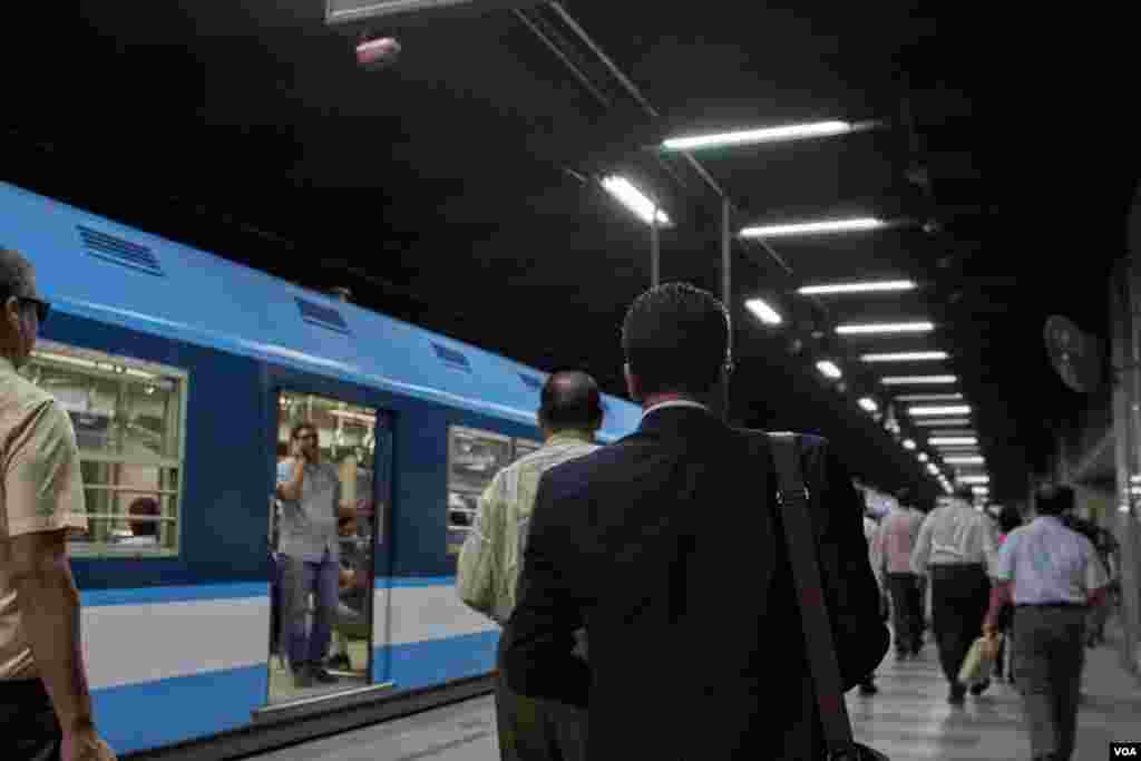 Power outages sometimes bring trains to a standstill, causing passengers to force open train doors and walk along the rails to the next station. (H. Elrasam/VOA)