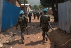 Soldiers from the United Nations Multidimensional Integrated Stabilization Mission in the Central African Republic (MINUSCA) patrol in PK12, 12 kilometers from downtown Bangui, where fighting raged, Jan. 13, 2021.