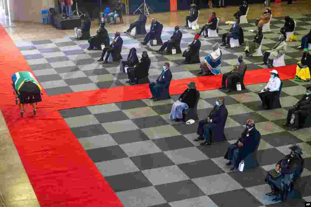 People attend the funeral service of South African anti-apartheid icon Andrew Mlangeni, in Soweto.