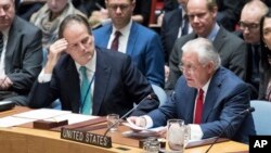 Mark Field British Minister of State for Asia and the Pacific, left, listens as U.S. Secretary of State Rex Tillerson speaks during a high-level Security Council meeting on the situation in North Korea at United Nations headquarters, Dec. 15, 2017.