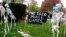 Coronavirus-themed Halloween decorations are displayed on a lawn in Tenafly, N.J., Oct. 22, 2020. 