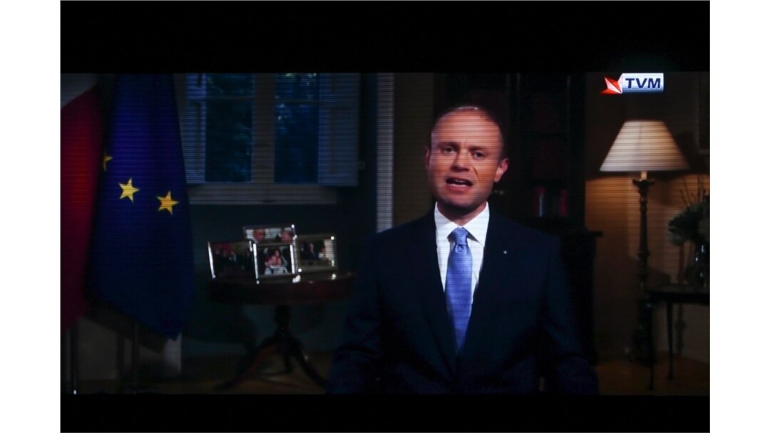 A photo shows a TV set broadcasting an address to the nation by Maltese Prime Minister Joseph Muscat, in Valetta, Malta, Dec. 1, 2019.