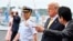 U.S. President Donald Trump, with Japan's Prime Minister Shinzo Abe, is seen as he leaves the Japanese destroyer JS Kaga, after a tour in Yokosuka, south of Tokyo, Japan, May 28, 2019.