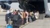 FILE - Evacuees assemble before boarding a C-17 Globemaster III during an evacuation at Hamid Karzai International Airport, Afghanistan, Aug. 18, 2021. (US Marine Corps/Lance Cpl. Nicholas Guevara/Handout via Reuters)