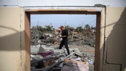 Palestinians inspect the ruins of a residential building for the Abu Muammar family after an Israeli airstrike in Rafah, Gaza Strip, on March 29, 2024.