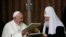 Pope Francis, left, and Russian Orthodox Patriarch Kirill exchange a joint declaration on religious unity at the Jose Marti International airport in Havana, Cuba, Feb. 12, 2016.