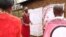 Trachoma monitor Lester Mortai teaches a group women how to prevent Trachoma at household level in Kajiado, Kenya. (Mohammed Yusuf/VOA)
