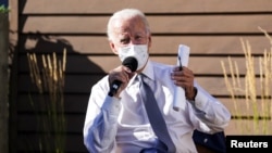 Joe Biden speaks about safely reopening schools amid the COVID-19 pandemic, in Wauwatosa, Wis., Sept. 3, 2020. The campaign stop was part of his trip to Wisconsin to discuss U.S. racial tensions in the wake of a Black man's shooting by police in Kenosha.