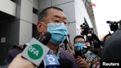 Media mogul and Apple Daily founder Jimmy Lai Chee-ying leaves from a police station after being arrested for illegal assembly during the anti-government protests in Hong Kong, Feb. 28, 2020.