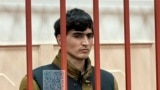 In this photo released by the Basmanny District Court press service on April 27, 2024, Dzhumokhon Kurbonov, a suspect in the Crocus City Hall shooting, stands in a cage in court in Moscow, Russia.