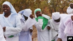 Members of an Apostolic Christian Church group gather for a prayer meeting on the outskirts of the capital Harare, Friday, Sept. 10, 2021. The Apostolic church is one of Zimbabwe's most skeptical groups when it comes to COVID-19 vaccines. (AP)