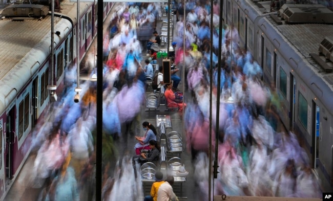 FILE- A general view of churchgate station during peak hours in Mumbai, India, Thursday, March 20, 2023. India is on track to become the world's most populous nation, surpassing China by 2.9 million people by mid-2023, according to data released by the United Nations on Wednesday. The South Asian country will have an estimated 1.4286 billion people against China's 1.4257 billion by the middle of the year, according to U.N. projections. (AP Photo/Rajanish Kakade, File)