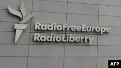 FILE - A sign for Radio Free Europe/Radio Liberty (RFE/RL) is pictured on the broadcaster's headquarters building, in Prague, Czech Republic, May 12, 2009. 