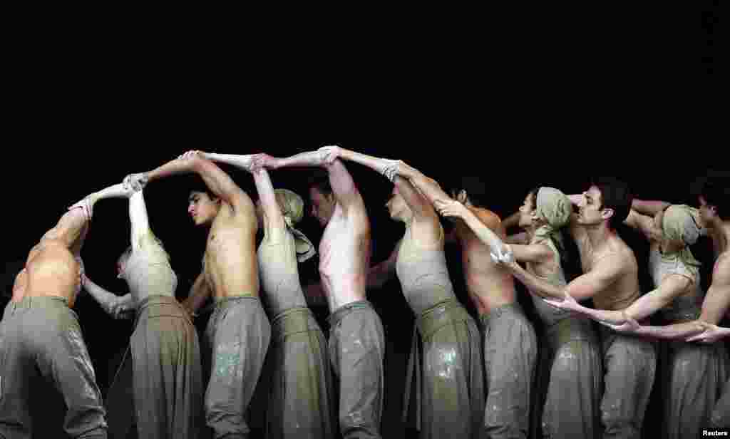 Members of the English National Ballet perform on the Pyramid stage at Worthy Farm in Somerset, during the Glastonbury Festival, Britain.