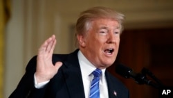 FILE - President Donald Trump speaks during a bill signing event for the "Department of Veterans Affairs Accountability and Whistleblower Protection Act of 2017" in the East Room of the White House.