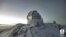 Potongan gambar dari video timelapse menunjukkan salju di puncak Mauna Kea di Hawaii, AS, pada 2 Desember 2021. (Foto: Canada-France-Hawaii Telescope via REUTERS)