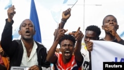 FILE - Somalis react during a march against the Ethiopia-Somaliland port deal along KM4 street in Mogadishu, Somalia, January 11, 2024.