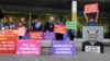 Protesters gather outside the County Court during the sentencing of Cardinal George Pell in Melbourne, Australia, Wednesday, March.13, 2019.