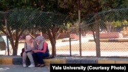 A researcher surveys a young Syrian girl using a new tool designed to measure resilience in Arabic-speaking teens.