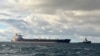 A handout photo released by the German Central Command for Maritime Emergencies on Jan. 10, 2025, shows the tanker Eventin as a towing connection is established from a tug boat at sea north of the German Baltic Sea island of Ruegen. 