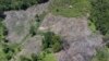 Bukit gundul terlihat di dekat kawasan terdampak banjir bandang di Pesisir Selatan, Sumatra Barat, 14 Maret 2024. (Foto: AP)