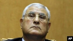 Egypt's chief justice Adly Mansour listens to a speech during his swearing in as interim president Thursday, July 4, 2013. 