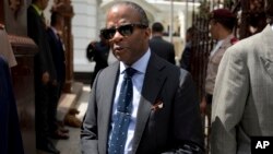 FILE - In this Jan. 5, 2018 photo, Todd Robinson the Chargé d'Affaires at the U.S. Embassy in Caracas waits for his car after a special session of the Venezuelan National Assembly in Caracas, Venezuela. 