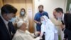 Pope Francis is greeted by a nun as he sits in a wheelchair July 11, 2021, inside the Agostino Gemelli Polyclinic in Rome, where he is recuperating following a July 4, 2021, surgery. (Vatican Media via AP) 