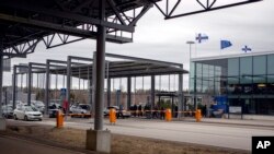 FILE - This March 17, 2020 photo, shows incoming traffic to Finland at the Nuijamaa border station in between Finland and Russia in Lappeenranta, Finland.