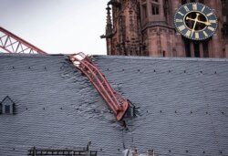 The jib of a crane is seen after it fell onto the roof of Frankfurt Cathedral during a storm, in Frankfurt, Germany, Feb. 10, 2020.