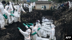 FILE - Members of the Congolese Red Cross and Civil Protection bury dozens of victims of the recent clashes in a cemetery in Goma, Democratic Republic of Congo, Feb. 4, 2025.